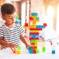 Colorful plastic building blocks for kids in a gift-ready bag, promoting creative play.