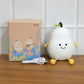 Close-up of the cute smiling face on the pear silicone lamp.