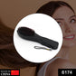 Ergonomic electric hair massager comb showing its vibrating function.