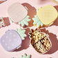 Vibrant pineapple Kids Bento Lunch Box with included fork and spoon.