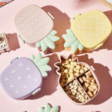 Vibrant pineapple Kids Bento Lunch Box with included fork and spoon.