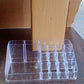 Clear acrylic makeup organizer displayed in bright room setting
