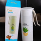 The portable glass water bottle being used during travel, emphasizing its convenience for fitness and adventure.