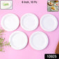 Stack of small round compostable paper plates for snacks and desserts