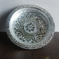 Side view of traditional silver finish lightweight plastic pooja thali
