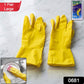 Pair of large yellow dishwashing gloves for kitchen jobs