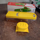 Close-up of vegetable slicer blade and yellow ABS plastic handle