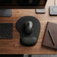 Person using ergonomic mouse pad at gaming desk