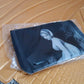 Folded Organivo Multi-Purpose Storage Bag demonstrating its compact size.