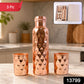 The elegant copper water bottle and two glasses, presented as a thoughtful gift set.