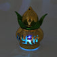 A single gold LED Kalash illuminating a Pooja Mandir setting with a gentle glow.