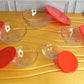 A glass bowl from the Organivo set filled with fresh salad, ready for serving or storage.