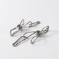 Durable stainless steel clothes pegs holding clothes securely