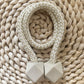 Pair of hexagonal magnetic curtain tiebacks elegantly holding a sheer curtain.