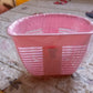 Lifestyle shot of the storage basket in use, holding various household items.