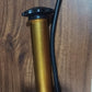 The portable hand air pump with its distinctive gold-plated finish, ideal for all sports enthusiasts.