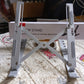 A person comfortably working at a desk with their laptop elevated on the portable stand.