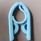 Single travel hanger shown in its fully compact, folded position for easy portability.