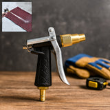 Durable gold hose nozzle with trigger lever for garden watering.