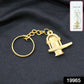 Close-up of golden Shivling metal keychain showing detailed craftsmanship