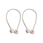 Non-magnetic pearl curtain tiebacks in use, adding a touch of elegance to living room decor.