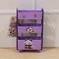 Mini storage trolley used to organize cosmetics on a dressing table.