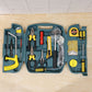 Yellow and sturdy carry case of  Home Tool Kit, ready for storage.