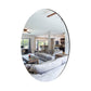 Set of two oval self-adhesive mirror stickers applied in a modern bathroom.