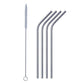 Bent stainless steel straw elegantly placed in a clear drinking glass.
