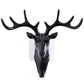 White deer head self-adhesive wall hook attached to a door, ready for use.