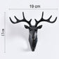 Stylish deer head hook in grey, functioning as a decorative hanger for a hat.