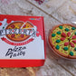 An overhead shot of the 7-piece Pizza Eraser Set, ideal for kids' stationery.