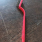 Person demonstrating the versatile use of the mini wire brush for detailed cleaning tasks.