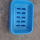 Close-up of the covered soap holder, emphasizing its smooth finish.