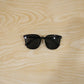 Close-up of stylish black sunglasses showing detailed design