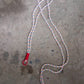 Lifestyle image showing a smartphone easily accessible via its phone lanyard from a bag.