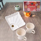 Ceramic tea cups paired with plastic square serving platter for stylish tea serving
