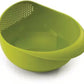 Ergonomic plastic rice strainer with handles, suitable for kitchen tasks.