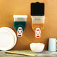 Front view of the 1100ml wall mounted oil dispenser showing its sleek design.