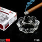 Elegant round glass ashtray with four cigarette slots for home or office use.