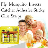 Fly catcher sticky strip hanging outdoors, trapping insects.