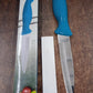 Detail of ergonomic plastic handle on multipurpose kitchen knife