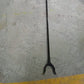 The pick up stick for elderly in a home setting, retrieving an item.