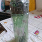 BPA-free plastic water bottle with carry case, ideal for outdoor travel.