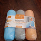 Three colorful travel toothbrush cases shown with dental hygiene essentials.