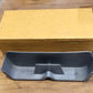 Sunglasses holder mounted on wall beside door for easy access