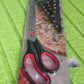 Packaging of the 2-piece set of Quickslice pizza cutter scissors.