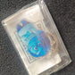 Detailed close-up of blue cartoon character acrylic keychain