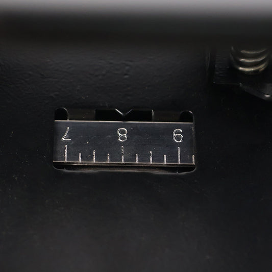 Close-up of hole punch area on metal 2-hole paper punch machine