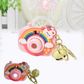 Close-up showing projector lens and sturdy zinc alloy ring on keychain